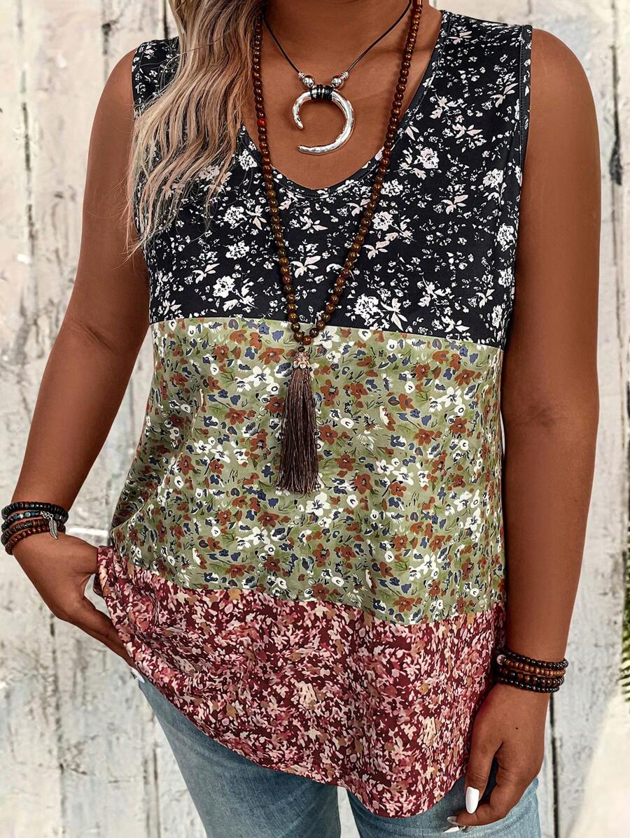 Multicolored floral sleeveless top worn by a women against a light wooden background