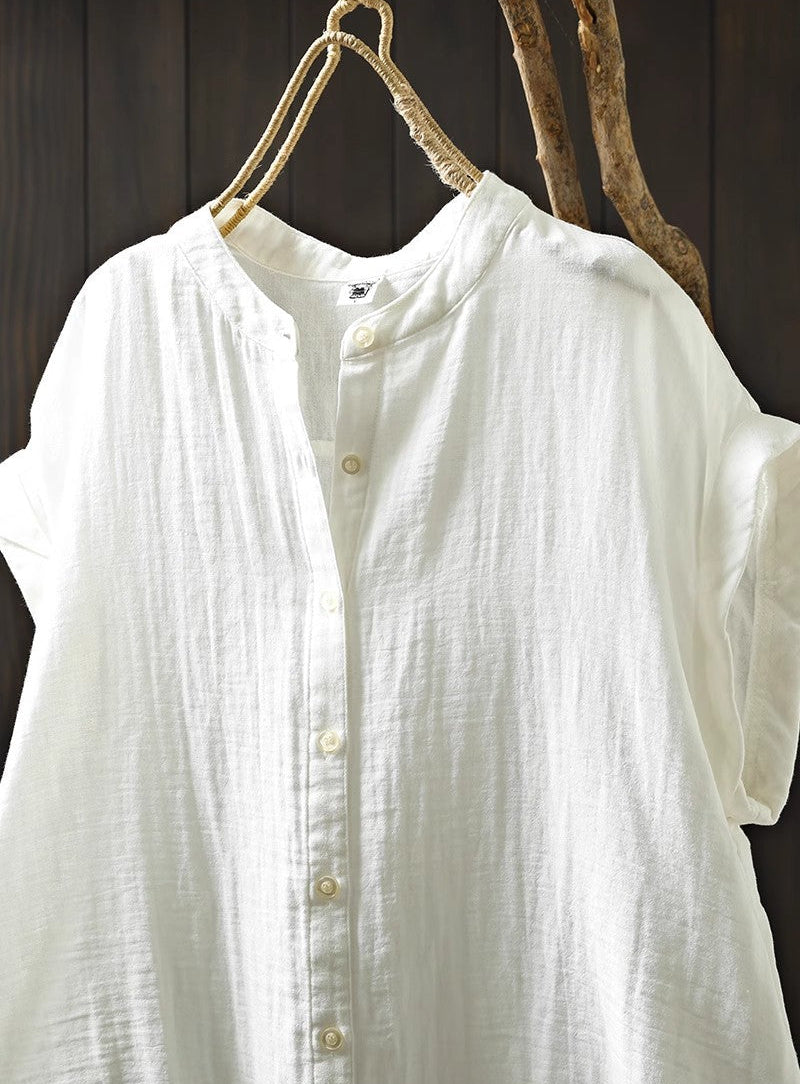 White shirt on a hanger against a wooden background