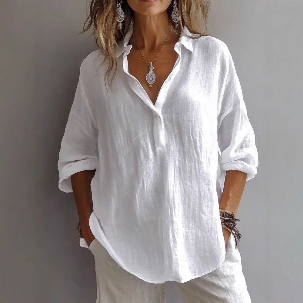 Person wearing a white button-up shirt and light pants against a gray background