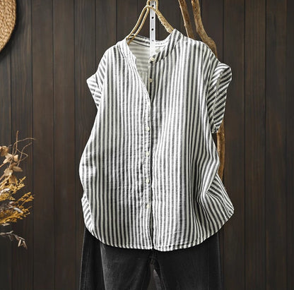Striped shirt hanging on a wooden wall with a rustic background